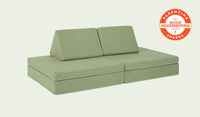 A Bamboo mossy sage Nugget play couch set up in a kids' sofa configuration.