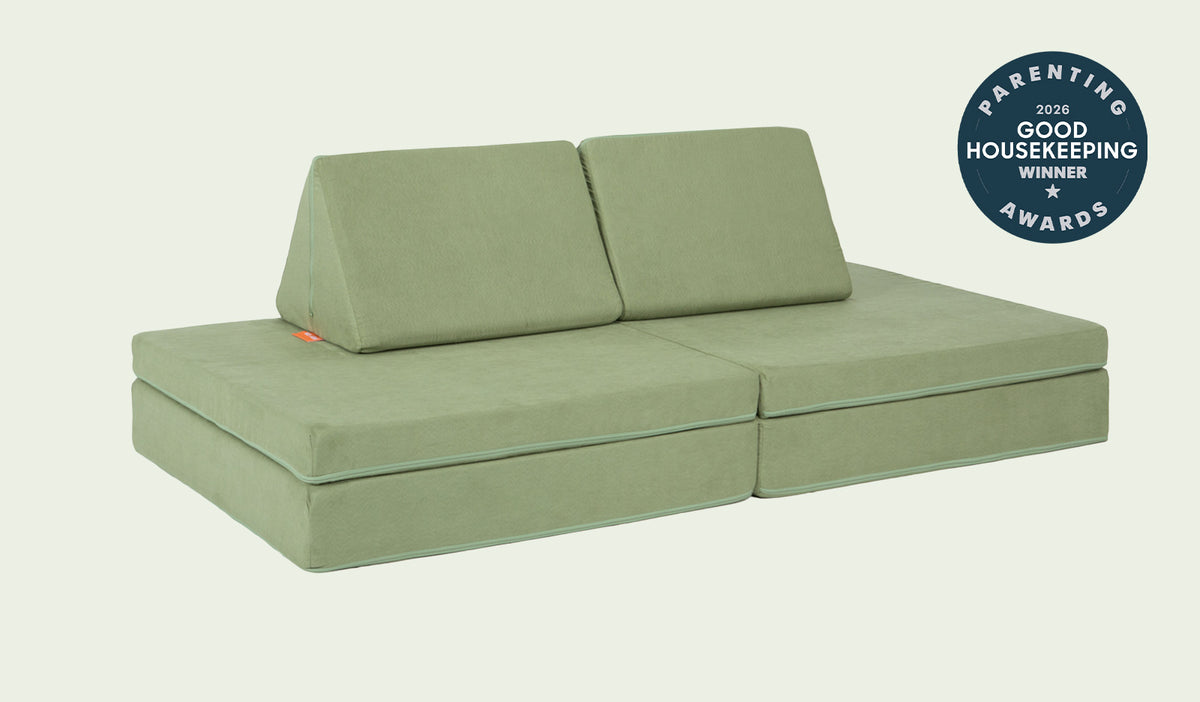 A Bamboo mossy sage Nugget play couch set up in a kids' sofa configuration.