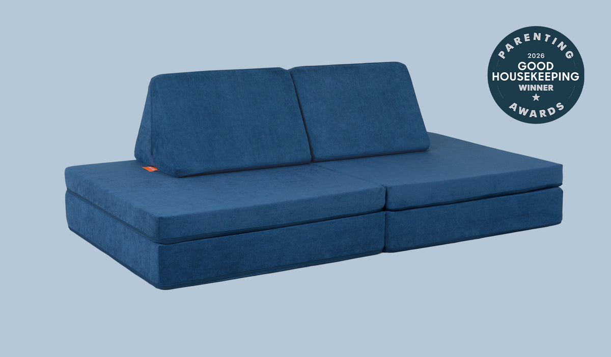 A Blueridge navy blue Nugget play couch set up in a kids' sofa configuration.