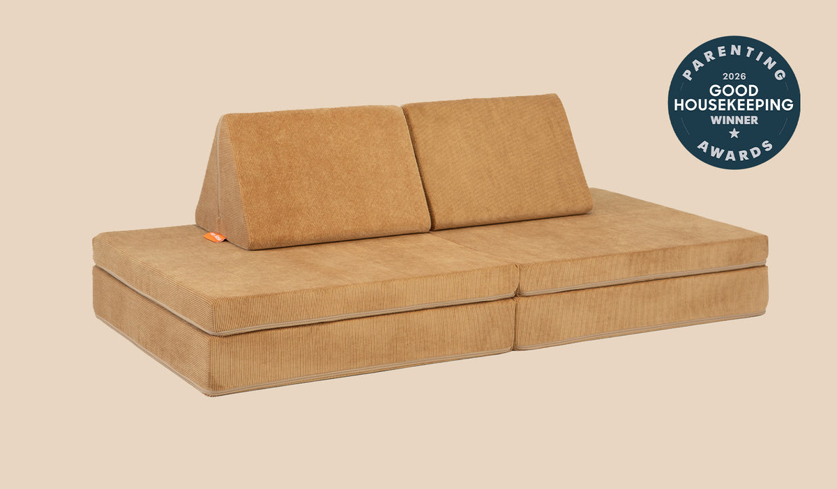 A Camelot camel brown Nugget play couch set up in a kids' sofa configuration.