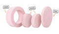 Four pieces of a blush pink Chunk play ottoman lined up: one large hoop, two sturdy nesting, and one wider pad for the lid.