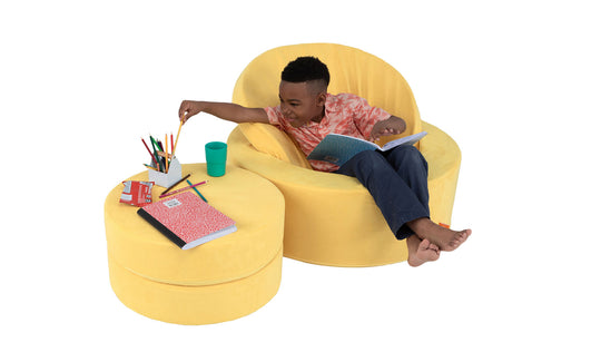 Boy doing schoolwork while sitting in chill mode in the Lemonade Chunk™