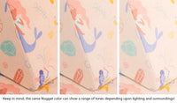 Close-up of a Nugget pillow in our Fable unicorn print across three lighting situations. One color can present as a range of tones depending on the room.