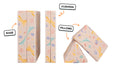 Four pieces of a unicorn-patterned Nugget play couch lined up: one foldable base, one foldable cushion, and two triangular pillows.