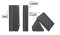 Four pieces of a charcoal gray Nugget play couch lined up: one foldable base, one foldable cushion, and two triangular pillows.