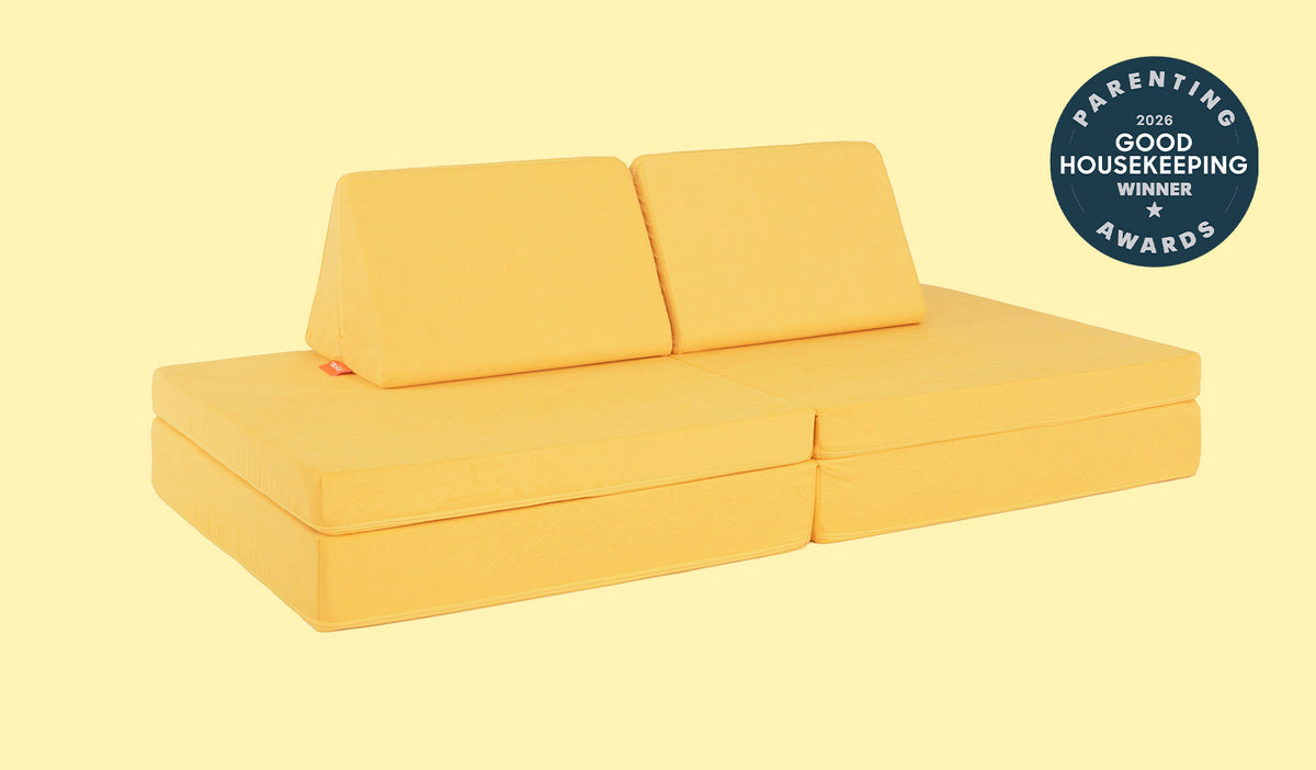 A Lemonade classic yellow Nugget play couch set up in a kids' sofa configuration.