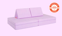 A Moonshot lilac purple Nugget play couch set up in a kids' sofa configuration.