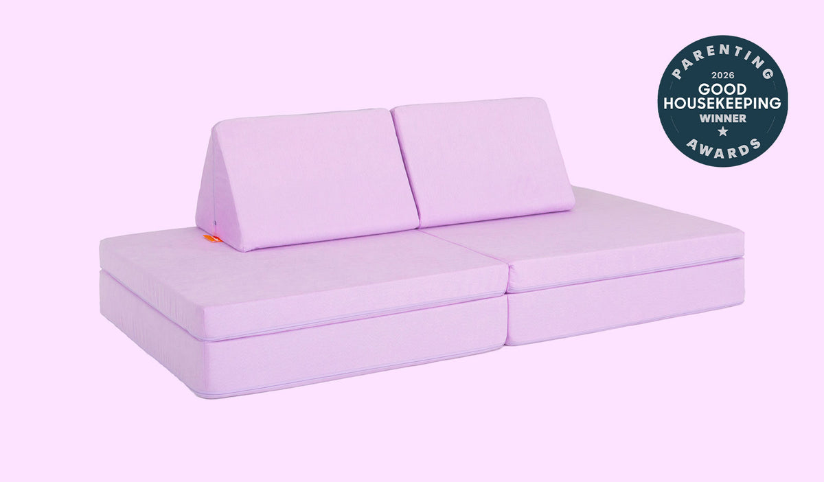 A Moonshot lilac purple Nugget play couch set up in a kids' sofa configuration.