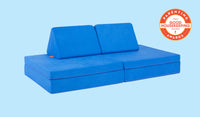 A Neptune cobalt blue Nugget play couch set up in a kids' sofa configuration.