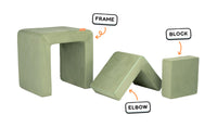 Four pieces of a mossy sage Smore play chair lined up: sturdy frame, one L-shaped elbow, and one square block.