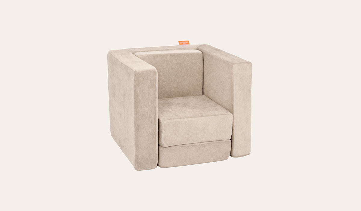 A Dunebuggy vintage beige Smore play chair set up in a kids' chair configuration.