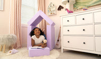 A child writes in a journal while relaxing on the pieces of a lilac purple Smore play chair.