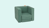 A Seamonster sea green Smore play chair set up in a kids' chair configuration.