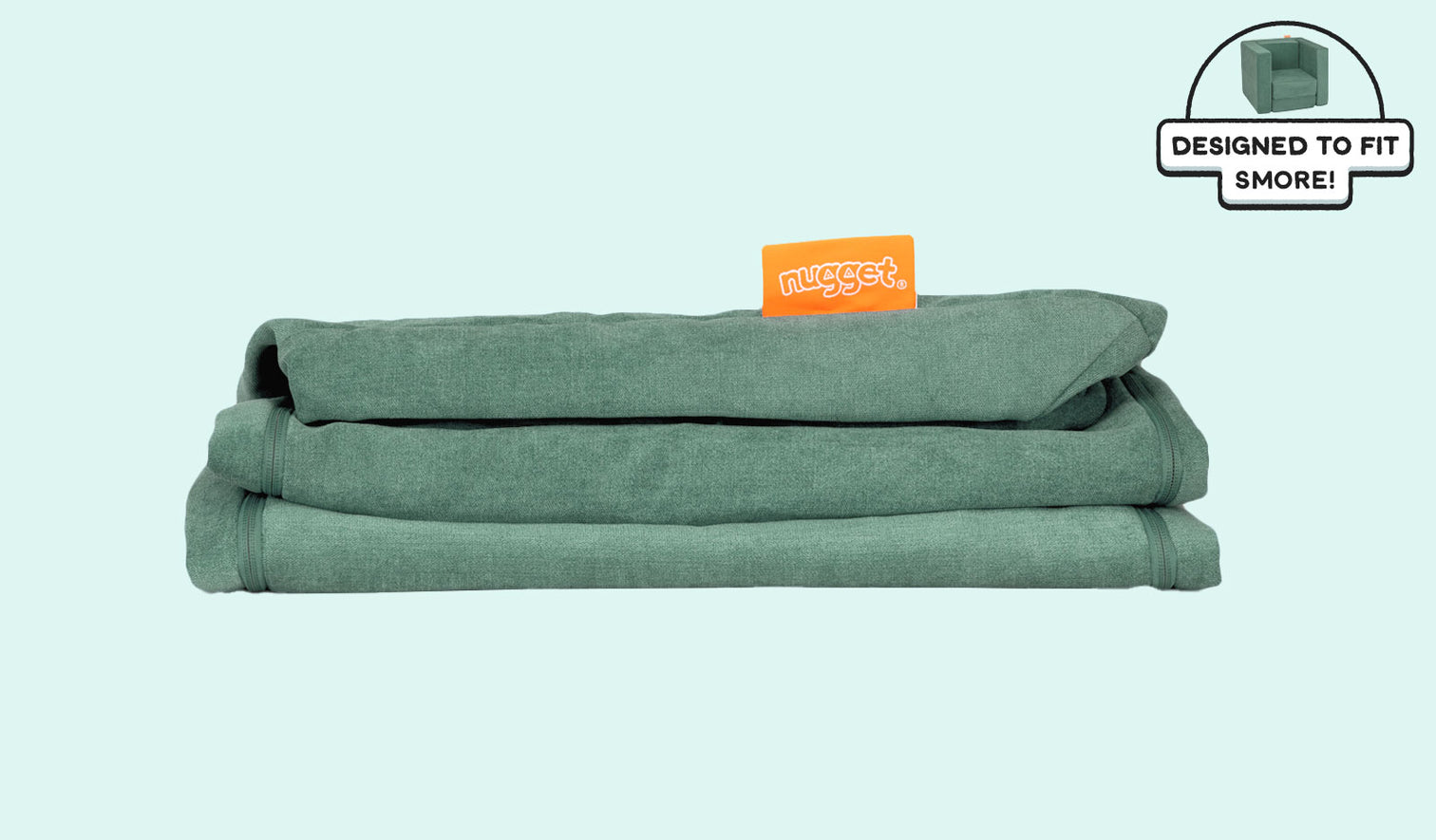 A neatly folded and stacked Smore Cover Set in sea green Seamonster.