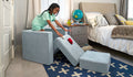 A child races toy cars down the pieces of a light gray-blue Smore play chair.