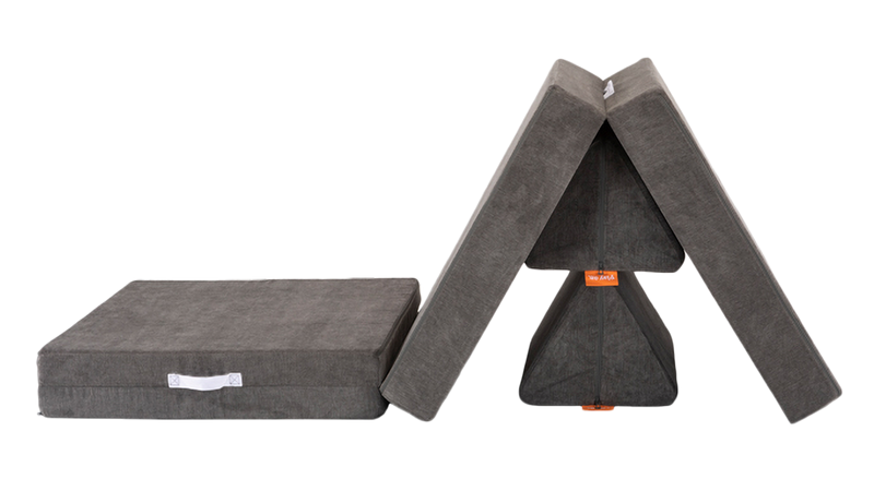 One charcoal gray Nugget play couch forms a Nugget obstacle course and mountain summit.