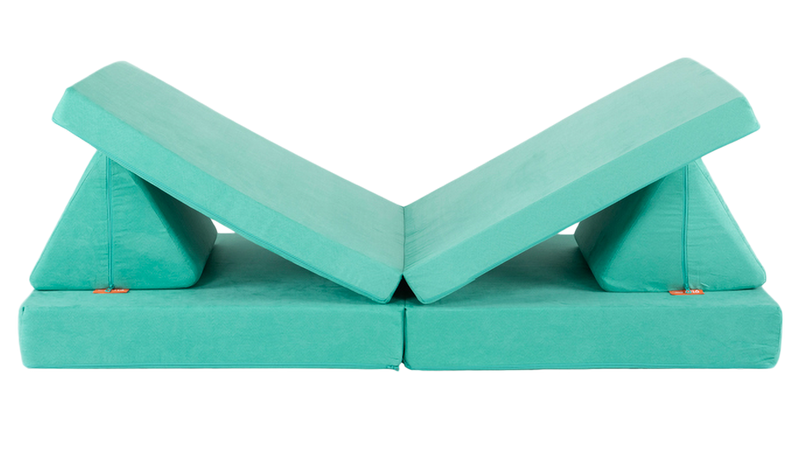 One minty green Nugget play couch forms a lounge build, with an elevated spot for one’s head and one’s feet.