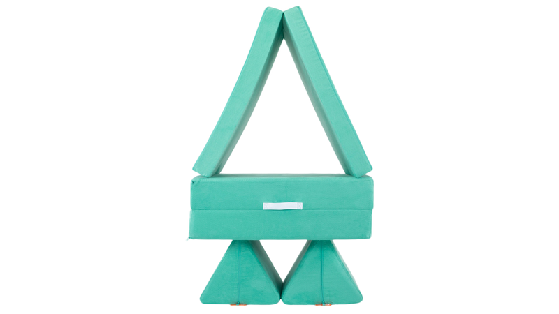 ne minty green Nugget play couch forms a tower build, ready for imaginative play.