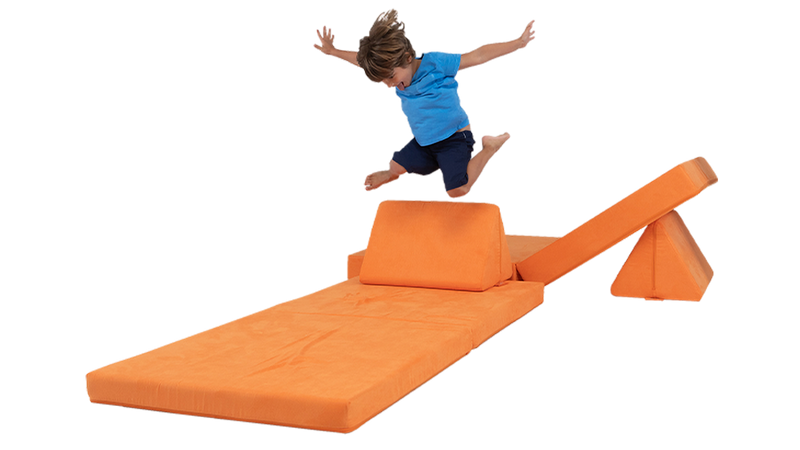 A child leaps from a Nugget pillow onto a cushion landing pad, made from one orange Nugget play couch.