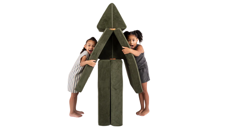 Two children hug a Nuggety tree, built from one forest green Nugget play couch.