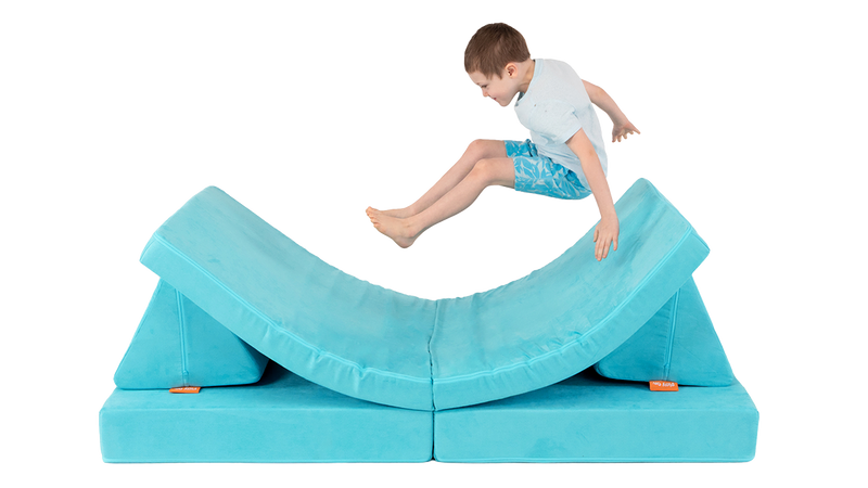 One child leaps onto a one-Nugget hammock build, made from a turquoise Nugget play couch.