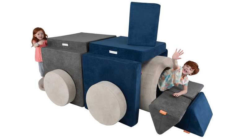 Two kids hide and play inside a cool Nugget fort tunnel constructed with two Nuggets and one Chunk play ottoman.