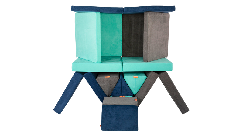 Three Nugget play couches form an imaginative pyramid build, ready for creativity and open-ended play.