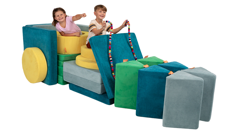 Two children ride in an imaginative sleigh made of three Nuggets and one Chunk, with Nugget pillow “reindeer” at the ready.