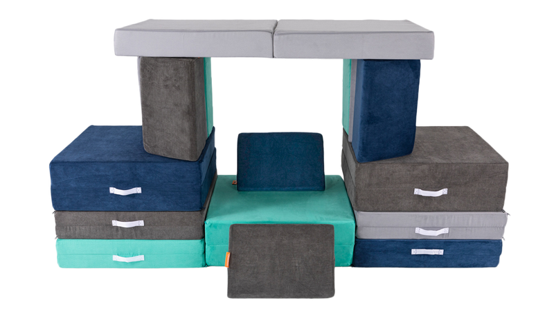 Four Nugget play couches are stacked and balanced to resemble a front porch, complete with a Nugget roof and pillars.