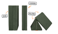 Four pieces of a forest green Nugget play couch lined up: one foldable base, one foldable cushion, and two triangular pillows.