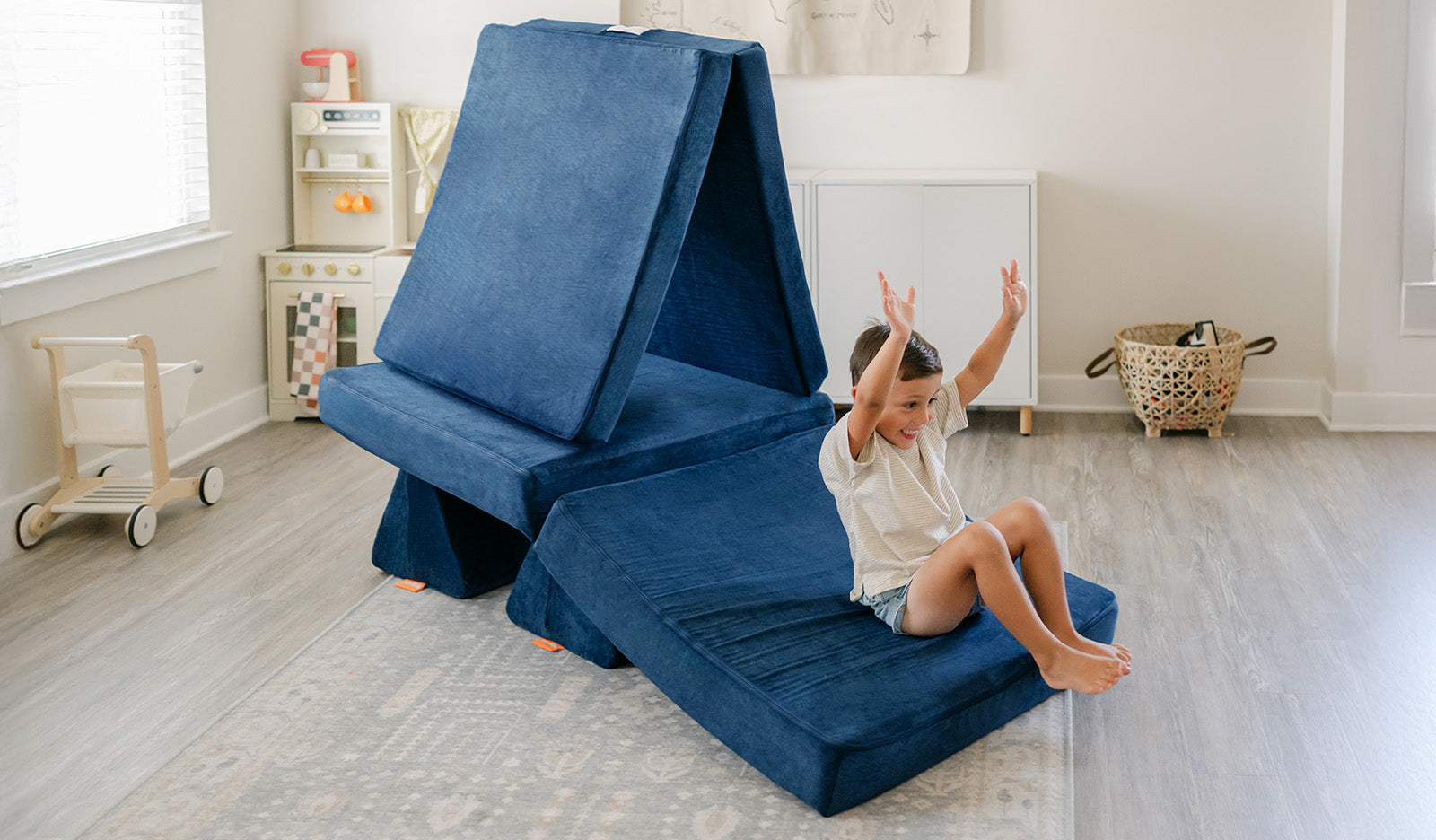 A child slides down a ramp made from a Blueridge Nugget®