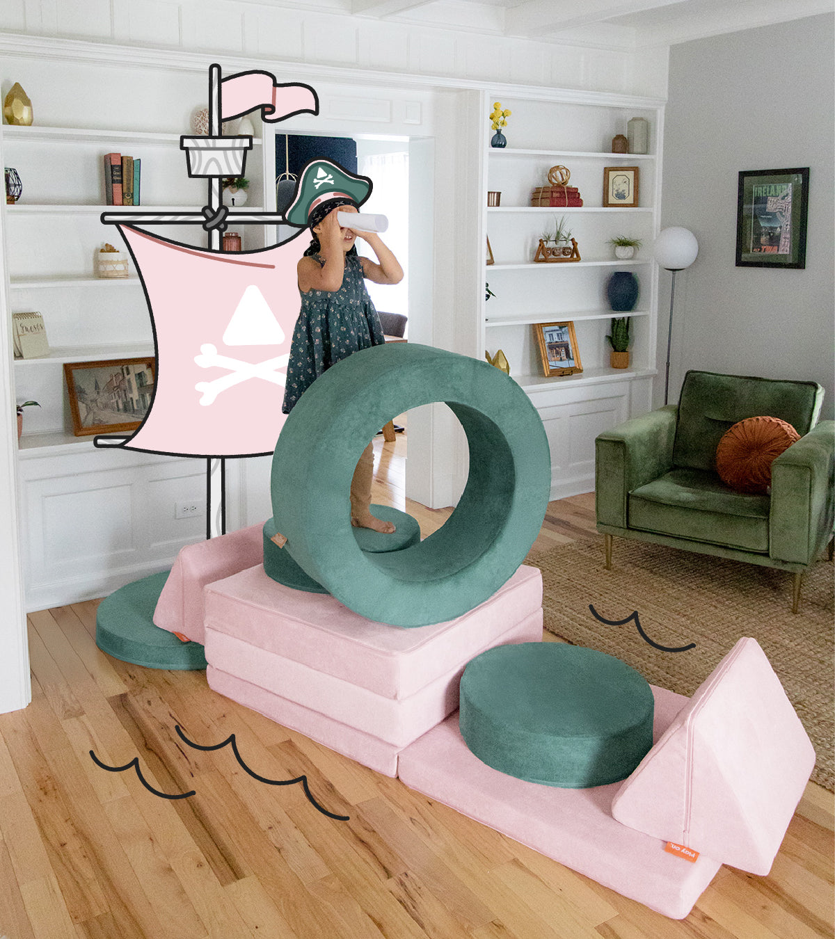 A child plays pretend on a Nugget play couch and Chunk play ottoman, arranged to resemble a pirate ship build.