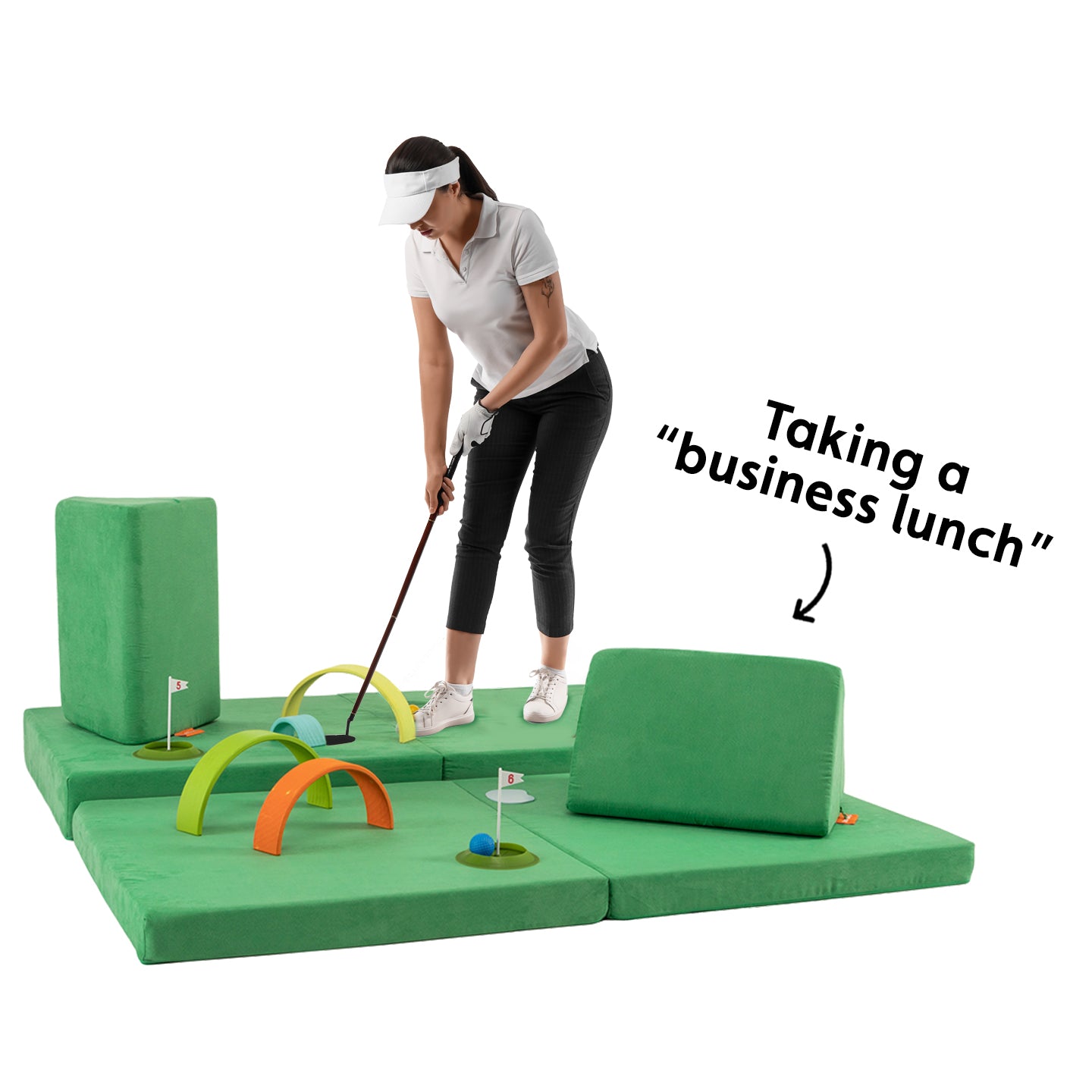 A woman plays mini golf on a Nugget play couch, pretending she’s taking a business lunch.