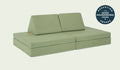 A Bamboo mossy sage Nugget play couch set up in a kids' sofa configuration.