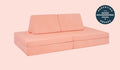 A Blossom light peach Nugget play couch set up in a kids' sofa configuration.