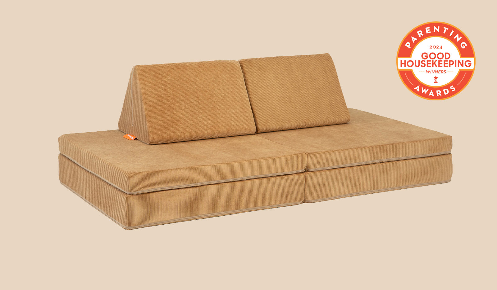 A Camelot camel brown Nugget play couch set up in a kids' sofa configuration.