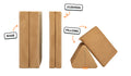 Four pieces of a camel brown Nugget play couch lined up: one foldable base, one foldable cushion, and two triangular pillows.