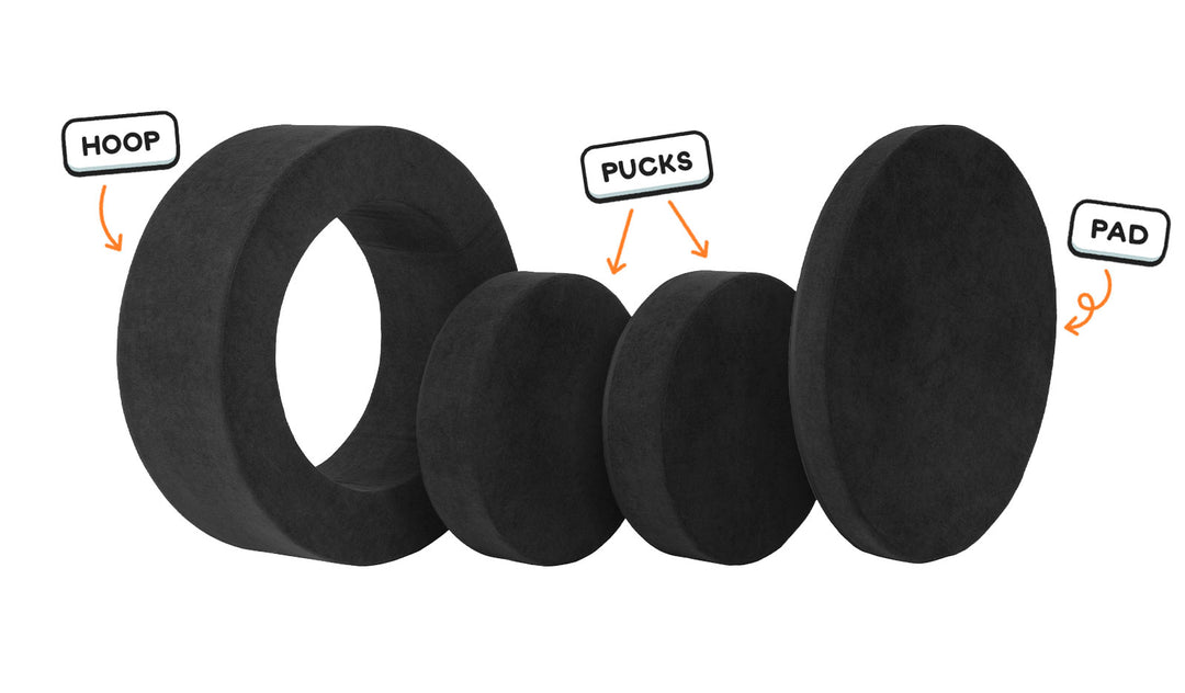 Four pieces of an all-black Chunk play ottoman lined up: one large hoop, two sturdy nesting, and one wider pad for the lid.