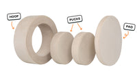 Four pieces of a vintage beige Chunk play ottoman lined up: one large hoop, two sturdy nesting, and one wider pad for the lid.