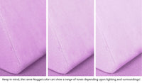 Close-up of a Nugget pillow in Moonshot lilac purple across three lighting situations. One color can present as a range of tones depending on the room.