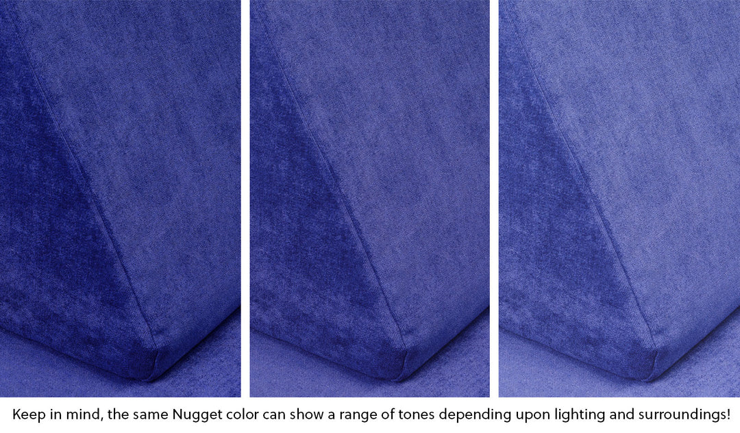 Close-up of a Nugget pillow in Nebula vibrant indigo across three lighting situations. One color can present as a range of tones depending on the room.