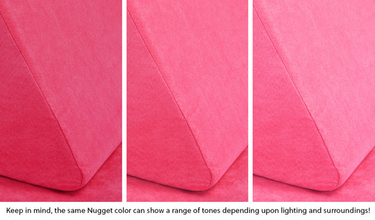 Close-up of a Nugget pillow in Popstar hot pink across three lighting situations. One color can present as a range of tones depending on the room.