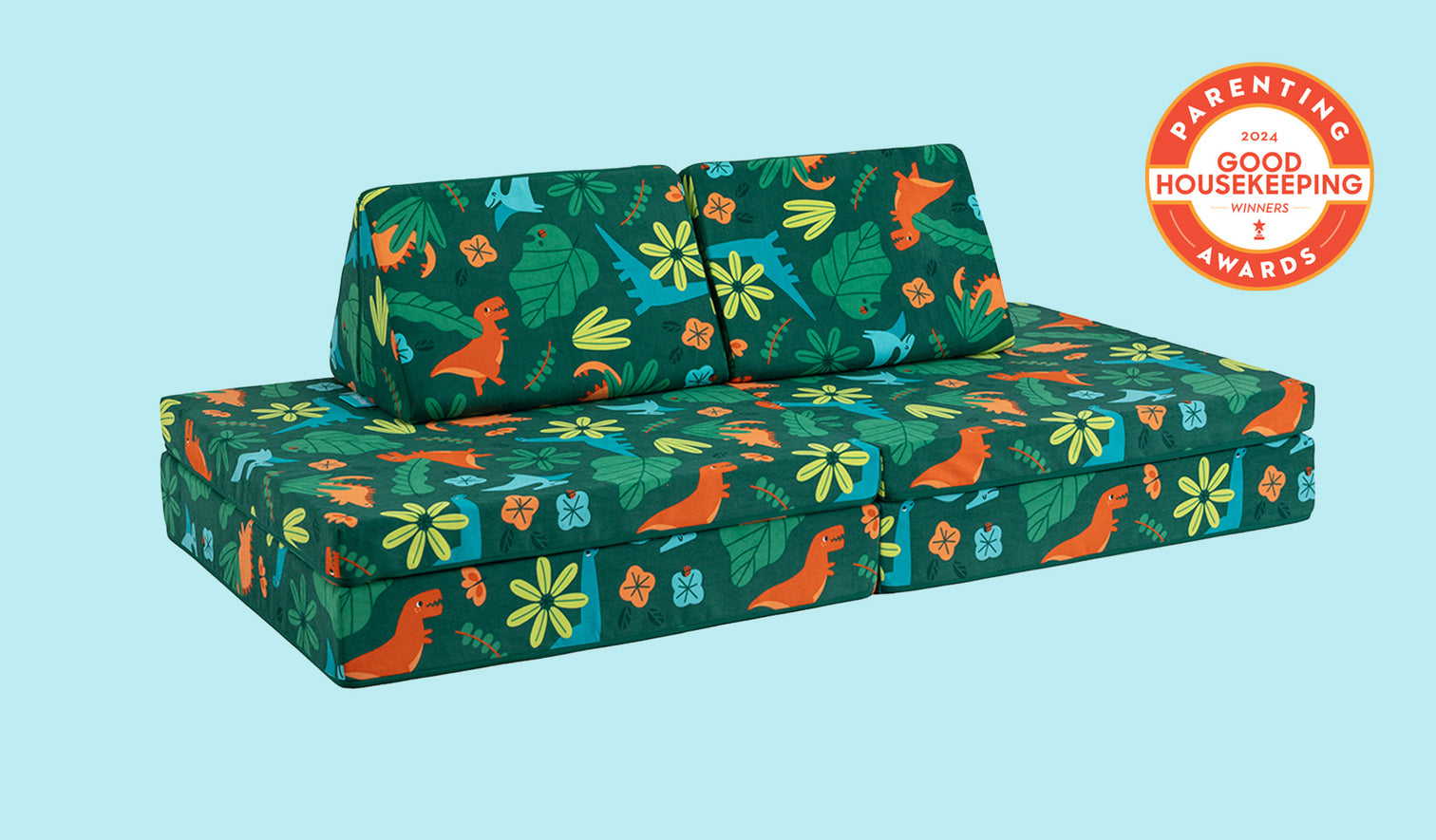 A lively dinosaur-patterned Nugget play couch set up in a kids' sofa configuration.
