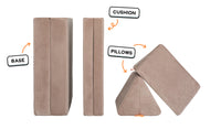Four pieces of an earthy taupe Nugget play couch lined up one foldable base one foldable cushion and two triangular pillows.