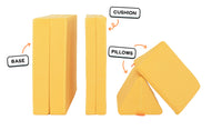 Four pieces of a classic yellow Nugget play couch lined up: one foldable base, one foldable cushion, and two triangular pillows.