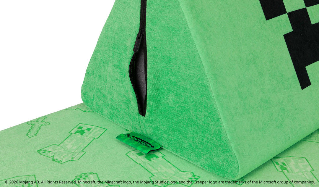 Close-up of the iconic Nugget tag dyed in Minecraft's iconic green, contrasted against a black zipper for the limited-edition Minecraft Collection.