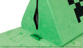 Close-up of the iconic Nugget tag dyed in Minecraft's iconic green, contrasted against a black zipper for the limited-edition Minecraft Collection.