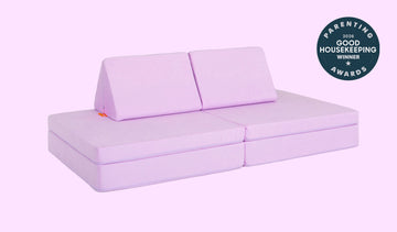 A Moonshot lilac purple Nugget play couch set up in a kids' sofa configuration.