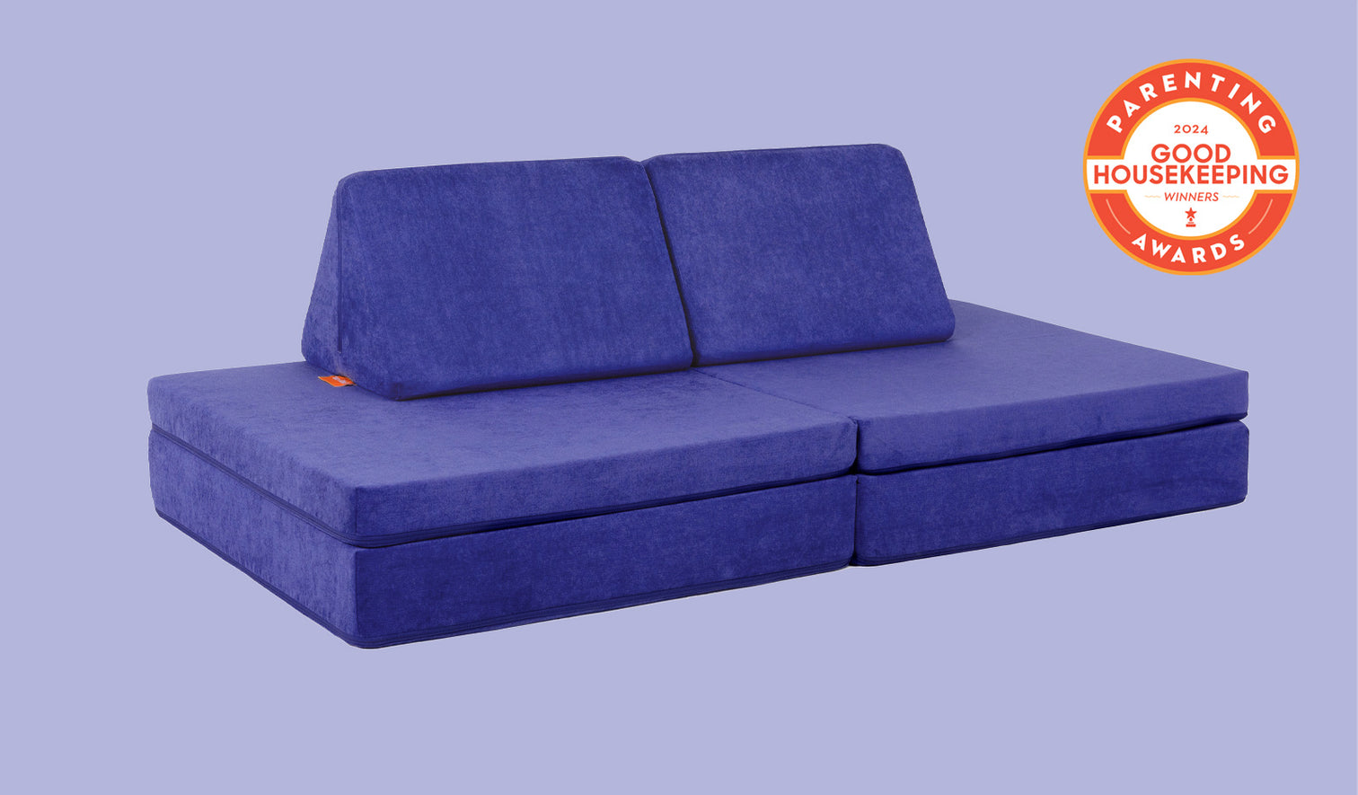 A Nebula vibrant indigo Nugget play couch set up in a kids' sofa configuration.