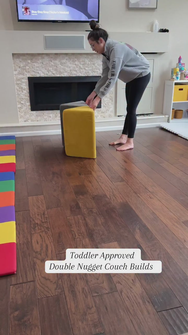Video shows a parent building various play couch forts with a yellow Nugget and gray Nugget.